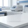 Clear 96-well pcr plate microplate standing upright on a laboratory bench