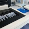 0.2 mL Optical Clear PCR Tubes – Flat & Domed Cap Options 4 Sterile PCR sample tubes in a rack on a laboratory bench